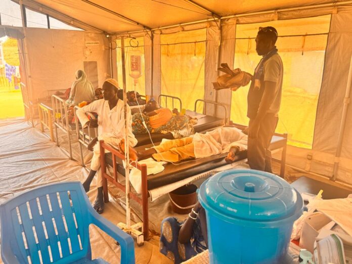 Hunger and Disease Spreading in War-Torn Sudan